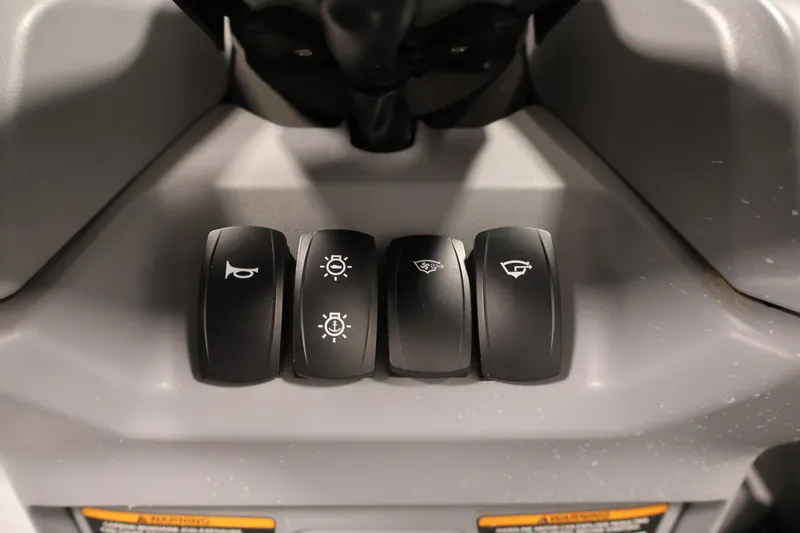 Slide: The Image of Dashboard controls of 2023 Sea-Doo Switch Sport 21, featuring various function buttons. - 19