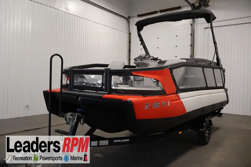 Slide: The Image of 2023 Sea-Doo Switch Sport 21 boat in showroom, featuring sleek design and vibrant colors. - 25