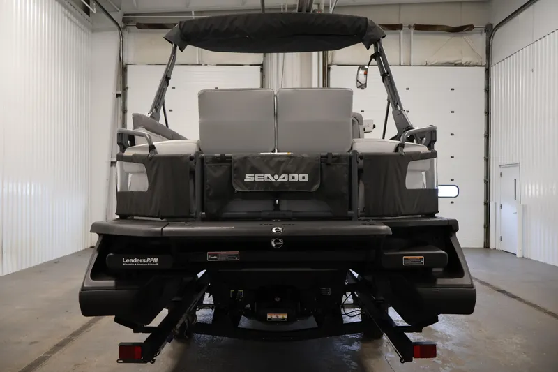 Slide: The Image of 2023 Sea-Doo Switch Sport 21 in a garage, rear view showcasing design and features. - 5