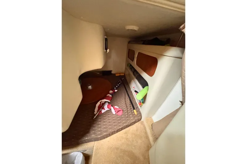 Slide: The Image of Interior cabin of a 2007 Rinker 270 Express Cruiser with storage and seating. - 11