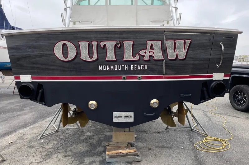 Slide: The Image of 2012 Cabo 32 Express boat named "Outlaw" at Monmouth Beach. - 13
