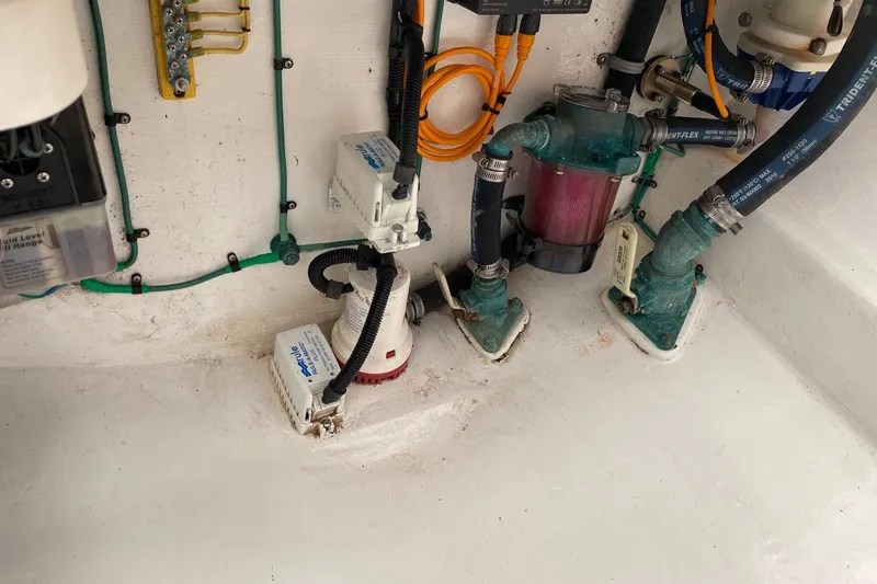 Slide: The Image of Bilge area of 2012 Cabo 32 Express boat with pumps and wiring. - 18