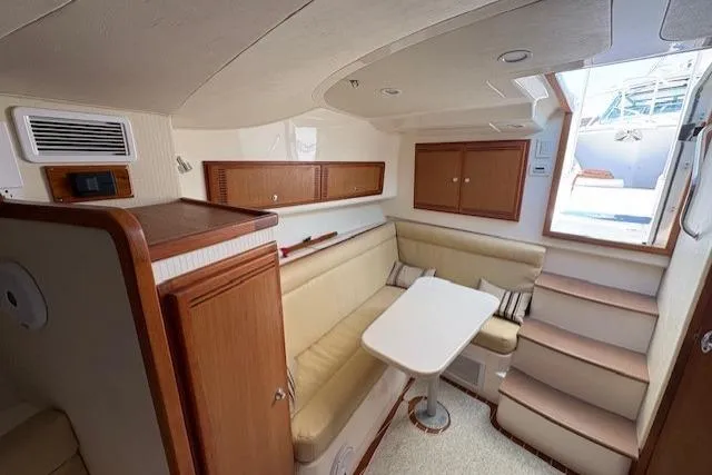 Slide: The Image of Interior view of 2012 Cabo 32 Express boat cockpit with helm and seating. - 20