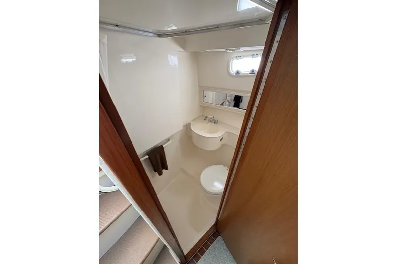 Slide: The Image of Interior of 2012 Cabo 32 Express boat with cozy cabin and kitchenette. - 24