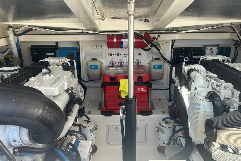 Slide: The Image of Compact bathroom in 2012 Cabo 32 Express boat with sink, toilet, and mirror. - 25