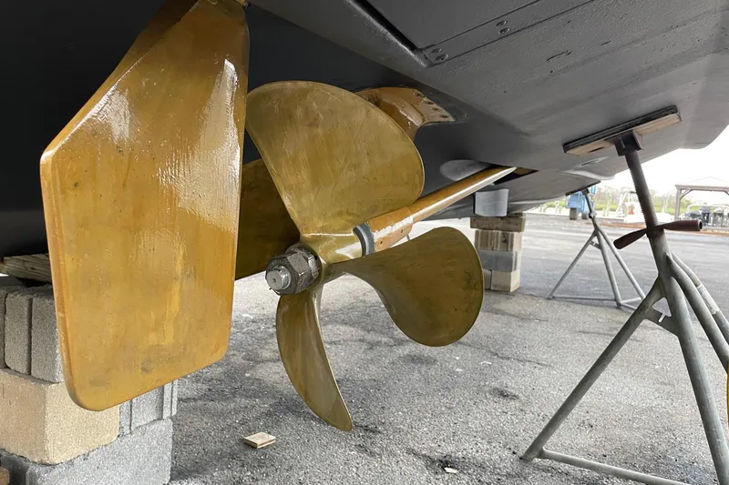 Slide: The Image of Propeller and rudder of a 2012 Cabo 32 Express boat on blocks. - 30