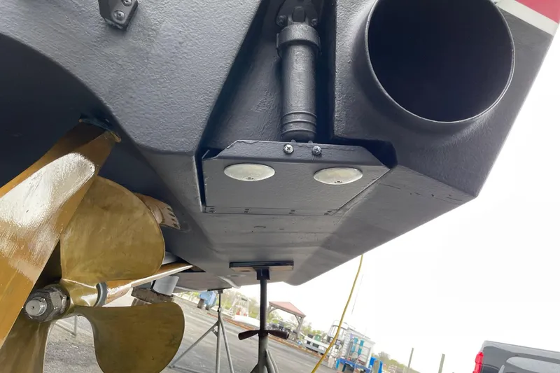 Slide: The Image of Propeller and rudder of 2012 Cabo 32 Express boat on dry dock. - 31