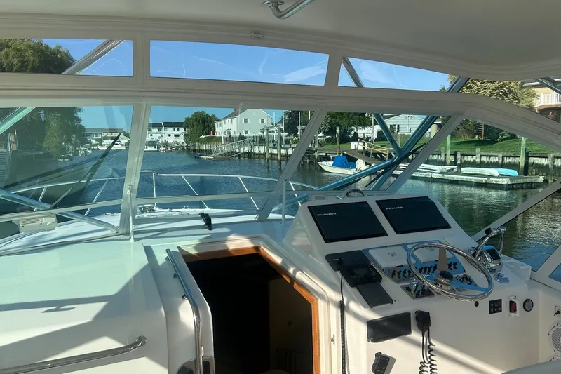 Slide: The Image of Interior view of 2012 Cabo 32 Express yacht cockpit with navigation equipment. - 8