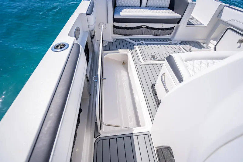 Slide: The Image of 2018 Nor-Tech 390 Sport Center Console boat interior with open storage compartment. - 10