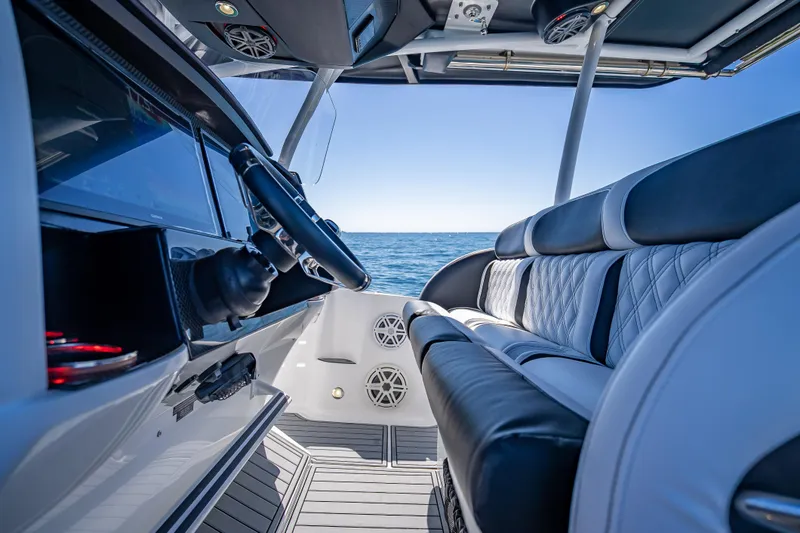 Slide: The Image of Interior of 2018 Nor-Tech 390 Sport Center Console boat with ocean view. - 2