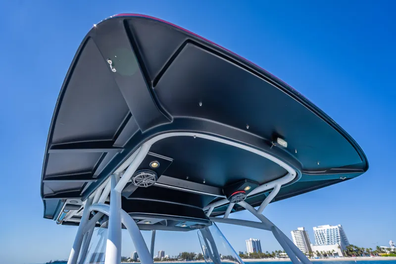Slide: The Image of 2018 Nor-Tech 390 Sport Center Console boat's T-top against clear blue sky. - 43
