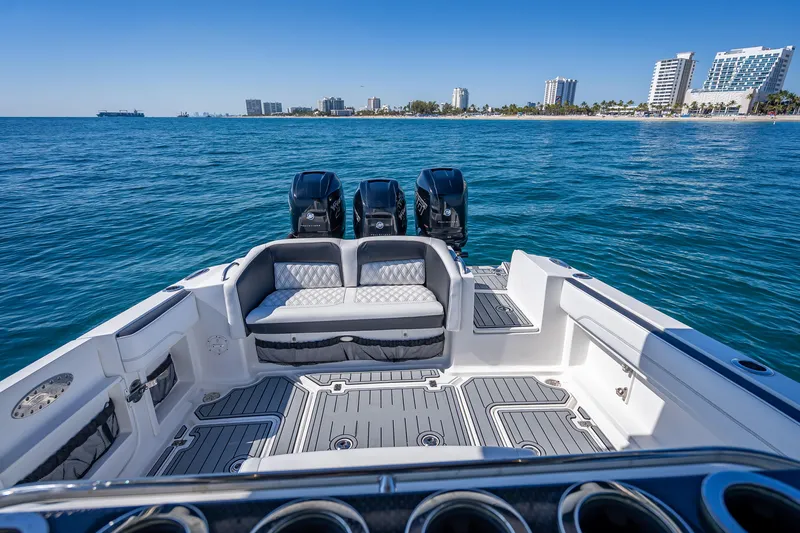 Slide: The Image of 2018 Nor-Tech 390 Sport Center Console boat on ocean, city skyline in background. - 5