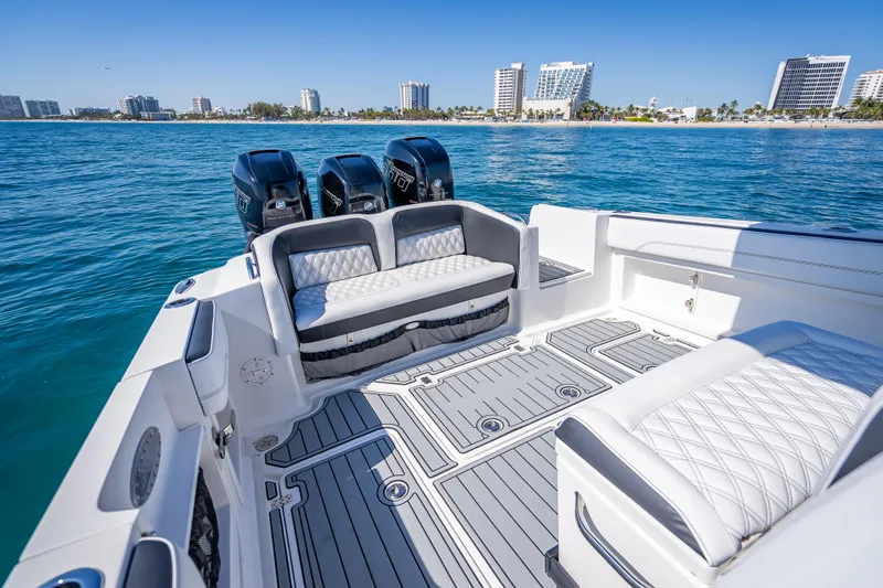 Slide: The Image of 2018 Nor-Tech 390 Sport Center Console boat with luxurious seating and ocean view. - 6