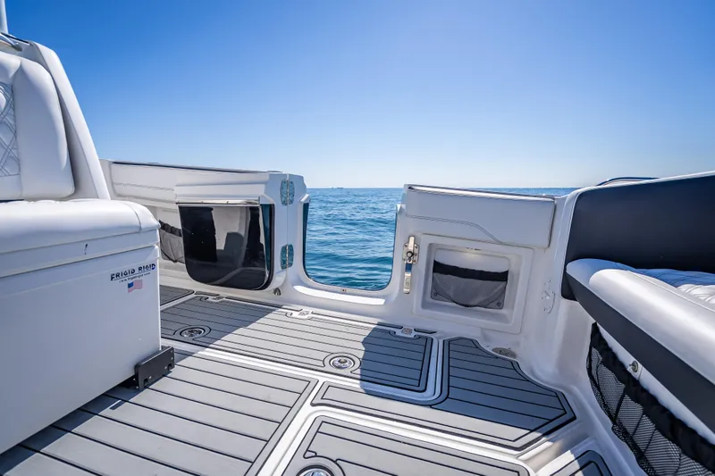 Slide: The Image of 2018 Nor-Tech 390 Sport Center Console boat interior with ocean view. - 8