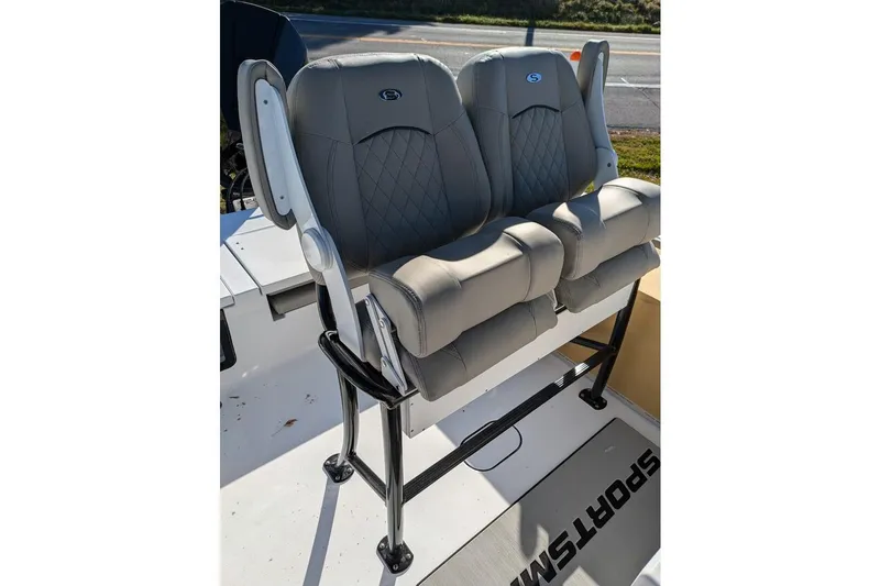 Slide: The Image of 2025 Sportsman Masters 227 Bay Boat with dual cushioned seats and sleek design. - 10