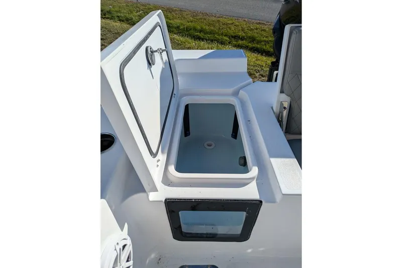 Slide: The Image of Open storage compartment on 2025 Sportsman Masters 227 Bay Boat, showcasing interior design. - 11