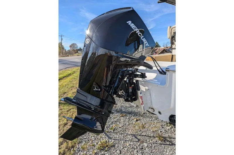 Slide: The Image of 2025 Sportsman Masters 227 Bay Boat with Mercury outboard engine on display. - 6