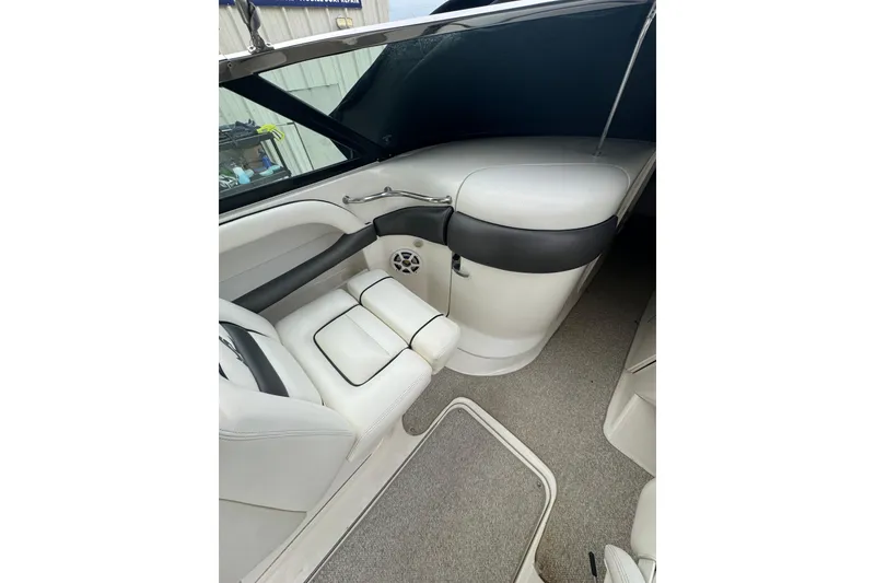 Slide: The Image of Interior of a 2005 Sea Ray 290 SLX boat, featuring white seating and sleek design. - 7