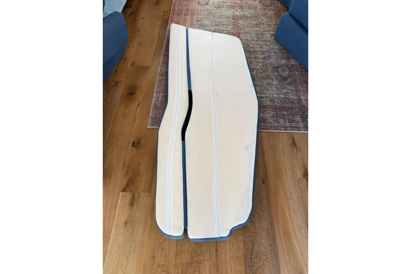 Slide: The Image of C&C 110 boat cushions on wooden floor, 2001 model. - 12