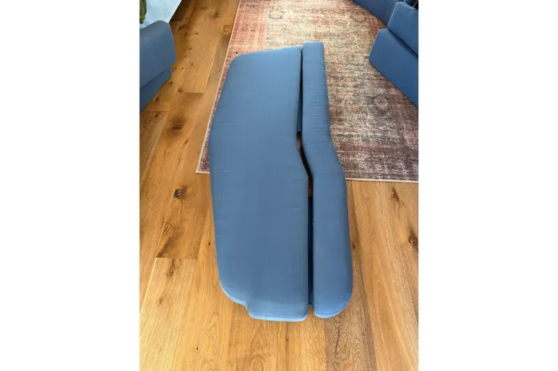 Slide: The Image of Blue boat cushions on wooden floor, C&C 110 model, 2001. - 14
