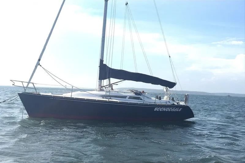 Slide: The Image of Sailboat "Boondoggle" on water, C&C 110 model, 2001, with calm sea and clear sky. - 3