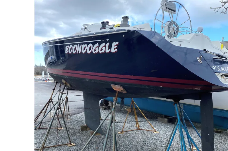 Slide: The Image of Sailboat "Boondoggle" on stands, C&C 110 model, 2001, in a boatyard. - 4
