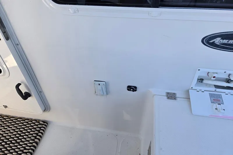 Slide: The Image of 2010 American Tug "34" Pilothouse Trawler deck with utility access and logo. - 104