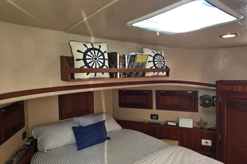 Slide: The Image of Cozy cabin interior of 2010 American Tug "34" Pilothouse Trawler with nautical decor. - 12