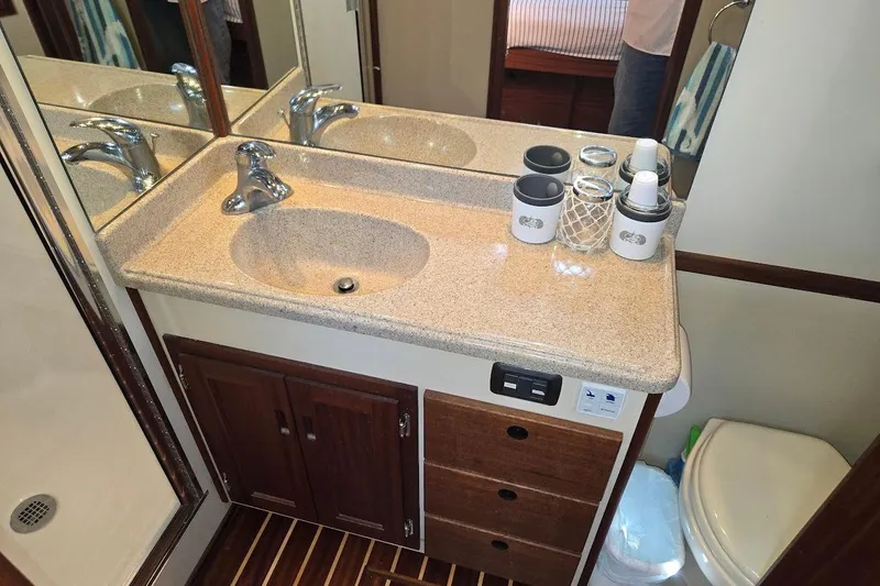 Slide: The Image of Bathroom vanity in 2010 American Tug "34" Pilothouse Trawler with sink and storage. - 17