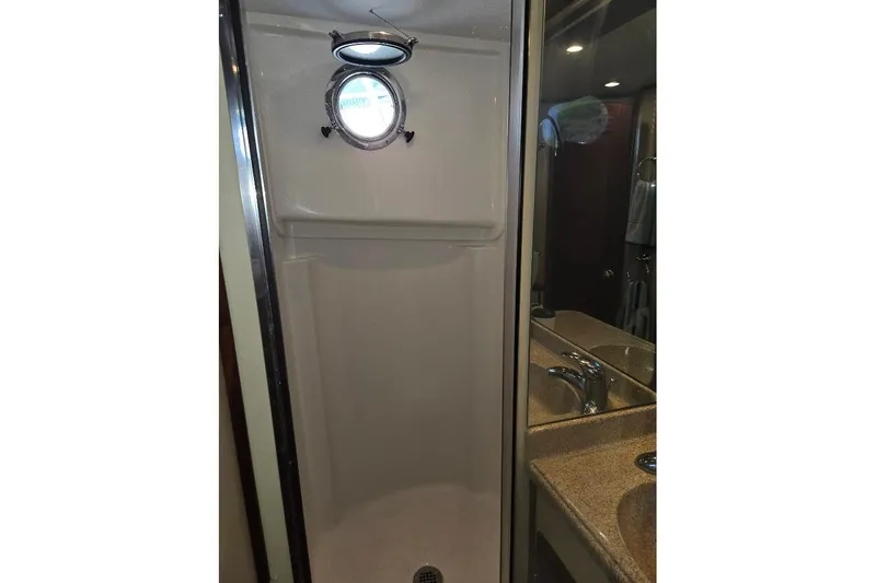 Slide: The Image of Shower area in 2010 American Tug "34" Pilothouse Trawler with porthole and sink. - 21