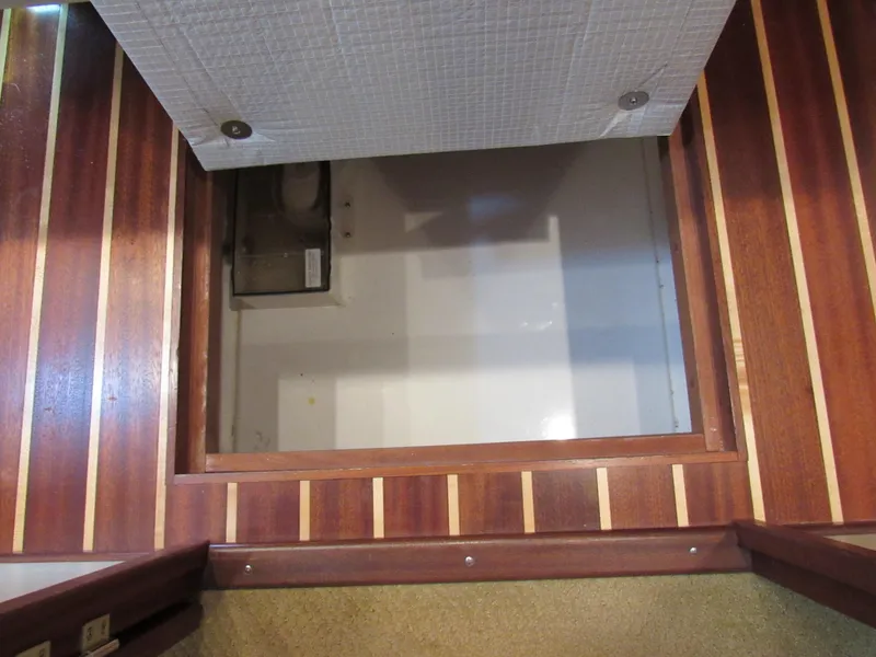 Slide: The Image of Wood-paneled storage compartment in 2010 American Tug 34 Pilothouse Trawler. - 23