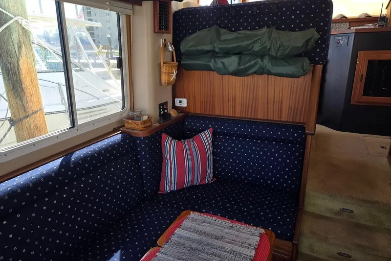 Slide: The Image of Interior of 2010 American Tug "34" Pilothouse Trawler with cozy seating and nautical decor. - 25