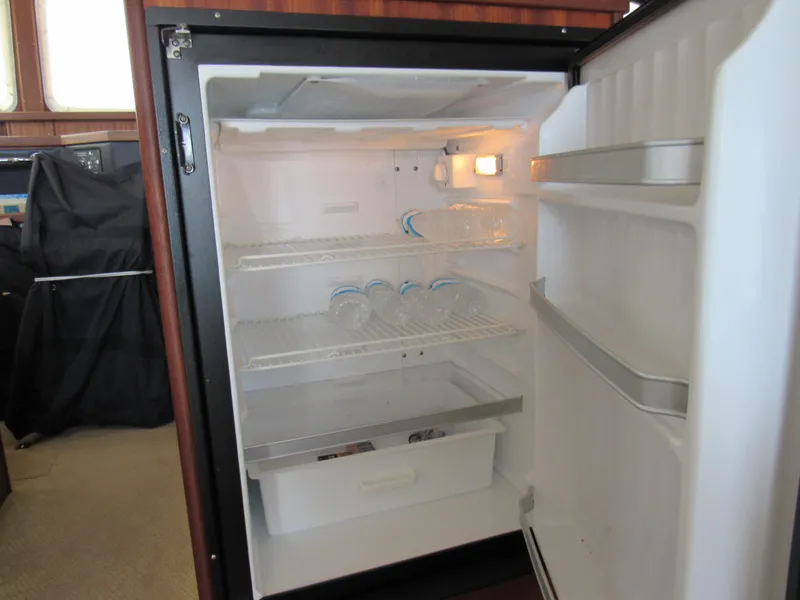 Slide: The Image of Open fridge in 2010 American Tug 34 Pilothouse Trawler. - 38