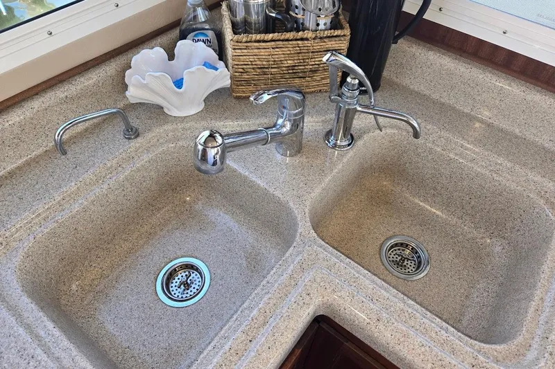 Slide: The Image of Dual kitchen sinks with chrome faucets in 2010 American Tug "34" Pilothouse Trawler. - 42