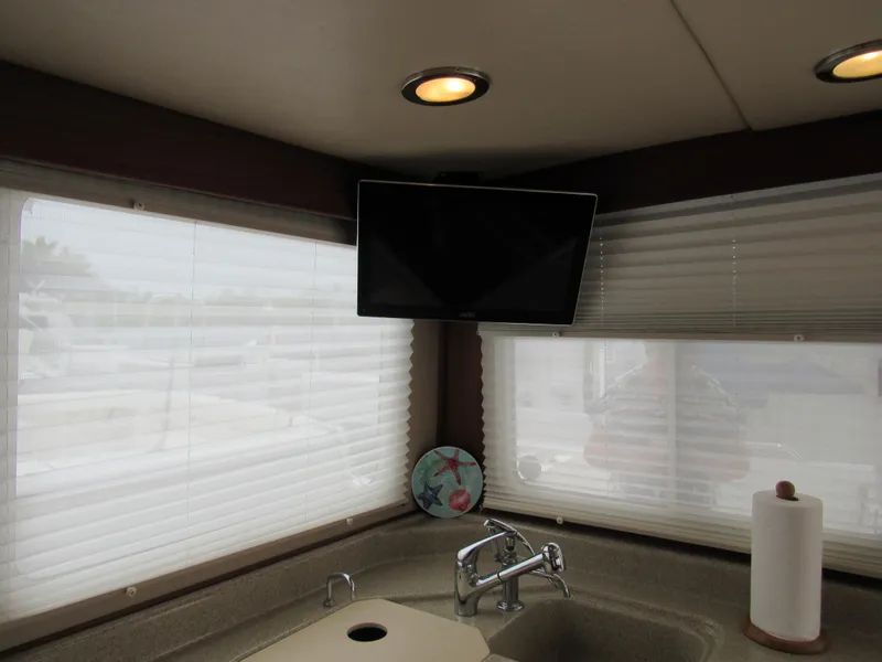 Slide: The Image of Interior of 2010 American Tug 34 Pilothouse Trawler with TV and sink. - 43