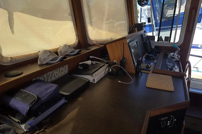 Slide: The Image of Pilothouse interior of 2010 American Tug "34" Trawler with navigation equipment and accessories. - 48