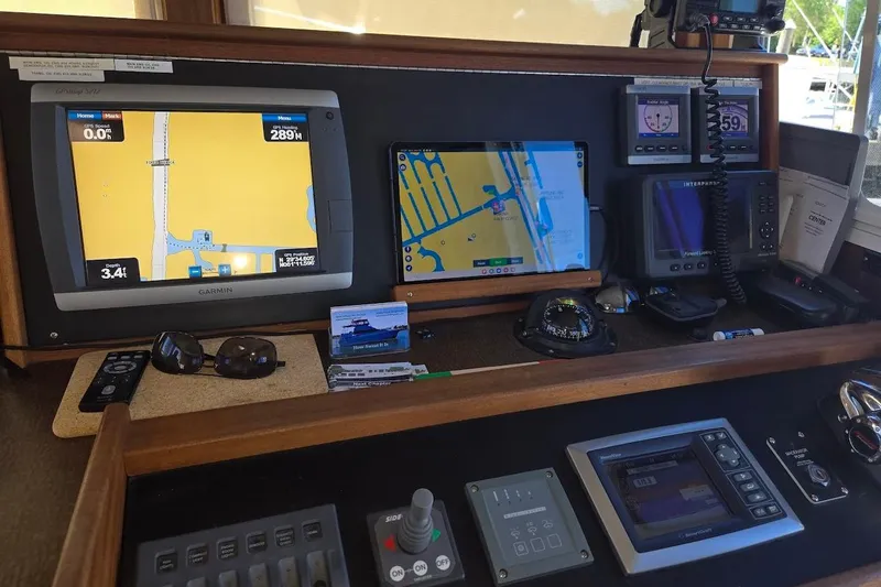 Slide: The Image of Pilothouse navigation equipment on a 2010 American Tug "34" Pilothouse Trawler, featuring Garmin displays. - 49