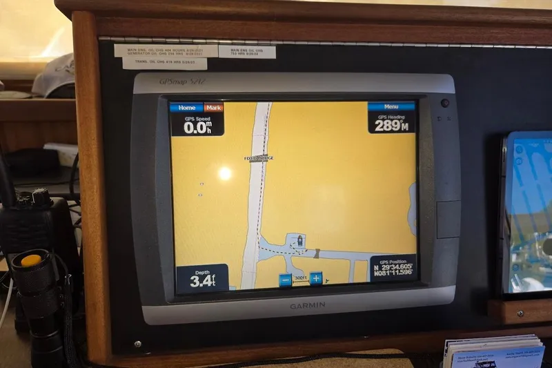 Slide: The Image of Garmin GPS display on 2010 American Tug "34" Pilothouse Trawler, showing navigation details. - 50