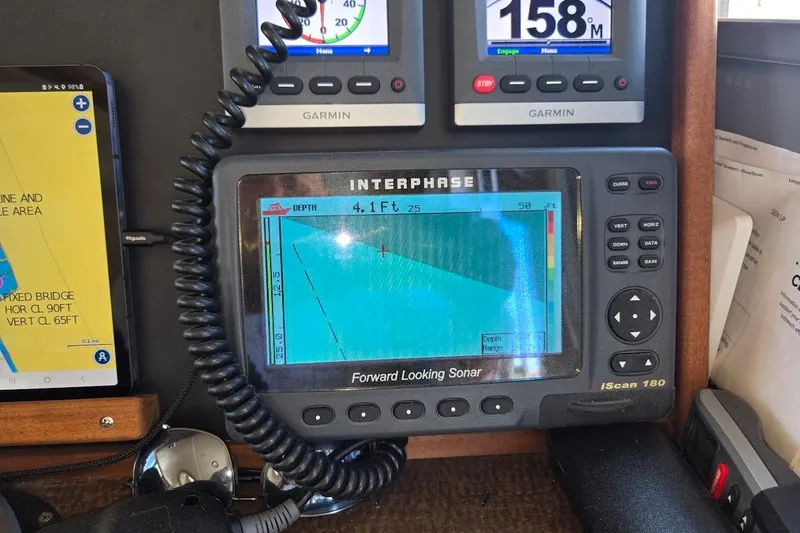 Slide: The Image of Pilothouse electronics on 2010 American Tug "34" Trawler, featuring sonar and navigation displays. - 53