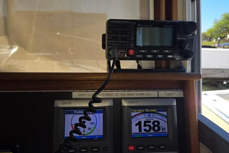 Slide: The Image of Pilothouse electronics of 2010 American Tug "34" Trawler, featuring navigation and communication devices. - 54