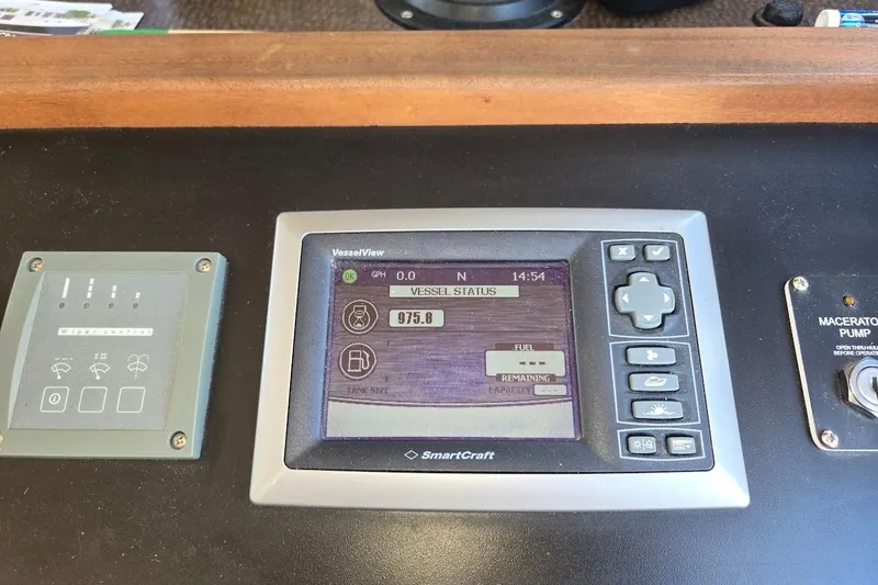 Slide: The Image of Control panel of a 2010 American Tug "34" Pilothouse Trawler displaying vessel status. - 56