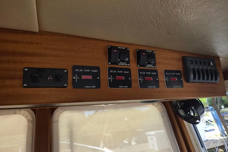 Slide: The Image of Pilothouse control panel of 2010 American Tug "34" Trawler with bilge pump indicators. - 59