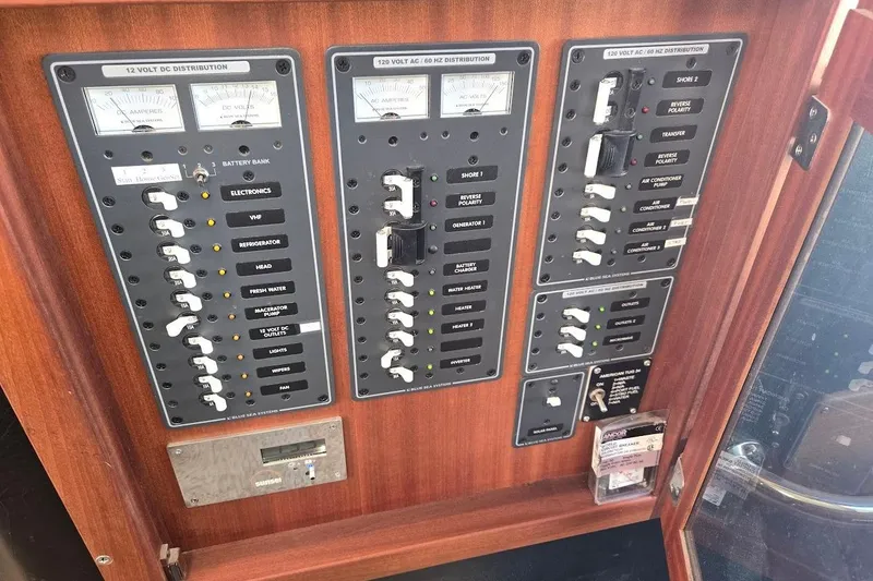 Slide: The Image of Electrical panel of 2010 American Tug "34" Pilothouse Trawler with switches and meters. - 60