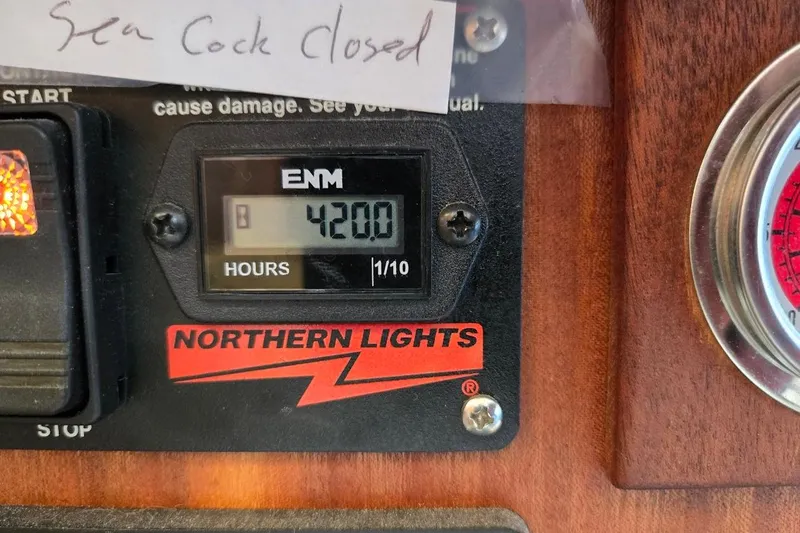 Slide: The Image of Hour meter reading 420.0 on 2010 American Tug "34" Pilothouse Trawler dashboard. - 61