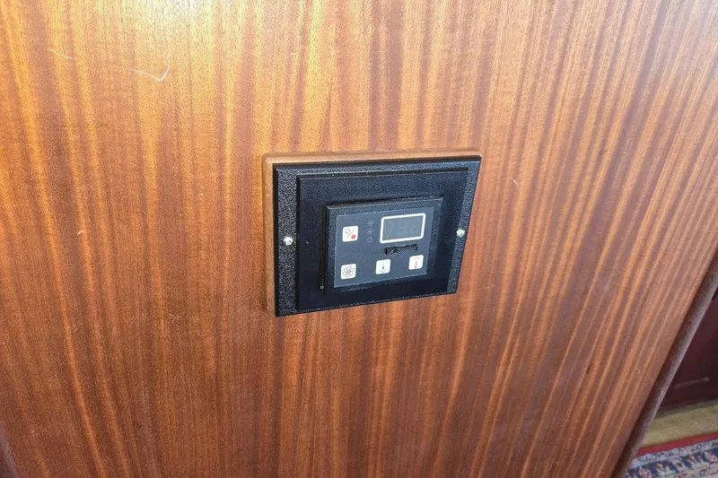 Slide: The Image of Control panel on wooden wall of 2010 American Tug "34" Pilothouse Trawler. - 65