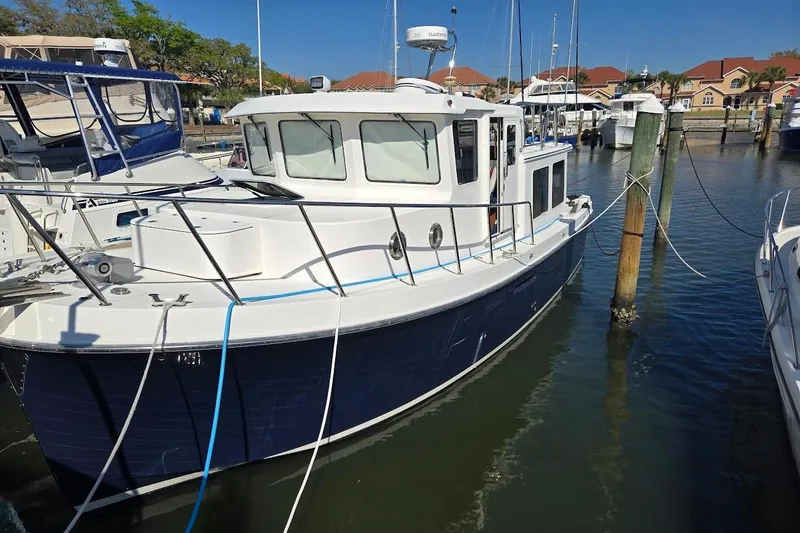 Slide: The Image of 2010 American Tug "34" Pilothouse Trawler docked at marina, sunny day. - 75