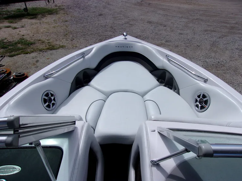 Slide: The Image of 2006 Correct Craft SUPER AIR NAUTIQUE 210 TEAM EDITION boat interior with white seating and speakers. - 11