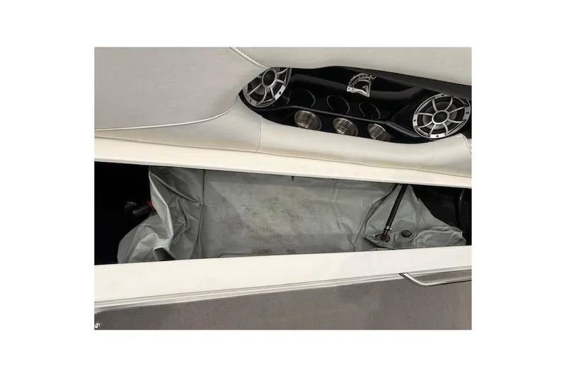 Slide: The Image of 2013 Centurion Enzo SV244 boat interior with storage compartment and speaker system. - 11