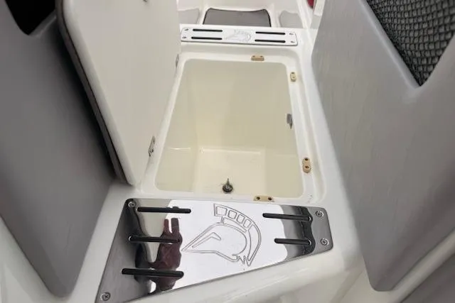 Slide: The Image of Open storage compartment on 2013 Centurion Enzo SV244 boat interior. - 15