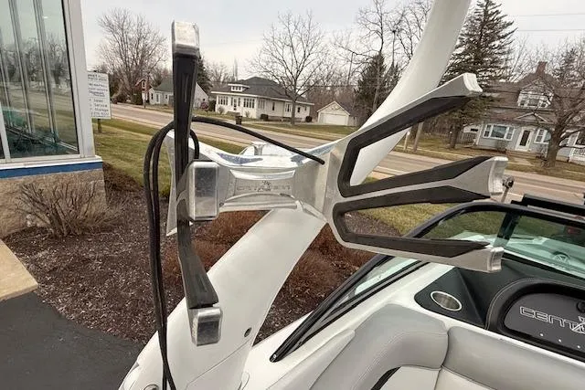 Slide: The Image of 2013 Centurion Enzo SV244 boat with wakeboard rack, parked outdoors. - 17